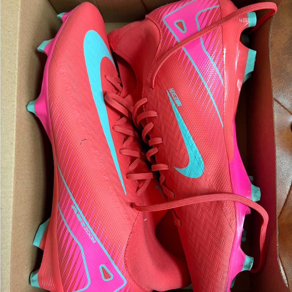 Nike Red and Pink soccer Cleats with Teal Accents